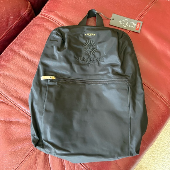 Tumi Handbags - Tumi Black Backpack with Gold Accents